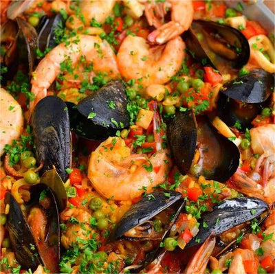 The Perfect Union: Serving Up Traditional Spanish Paella on Elegant Porcelain