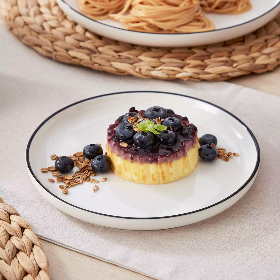 Dessert plates and bowls with cookies, fruit, and ice cream for mindful snacking