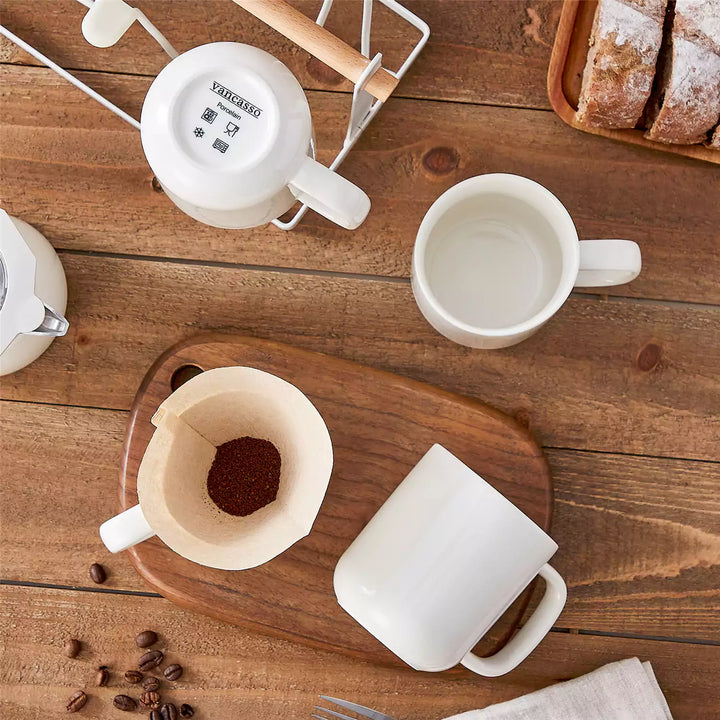 Thin and thick porcelain tea cups with different rim shapes for comparing heat retention and sipping comfort.