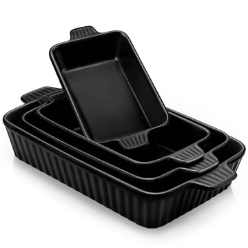 Set of black ceramic baking dishes with handles on a white background