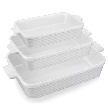 Three white ribbed porcelain baking dishes with cream interiors