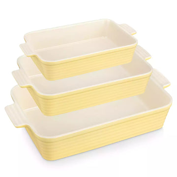 Three yellow ribbed porcelain baking dishes with cream interiors