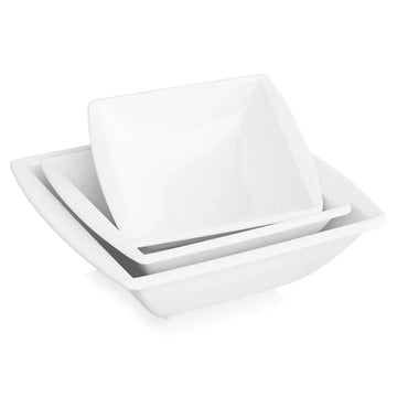 Assorted porcelain cereal bowls filled with colorful fruits, vegetables, and rustic bread