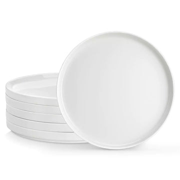 Set of white ceramic plates on a white background
