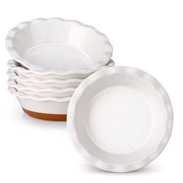 Set of white ceramic bowls with brown bottoms on a white background