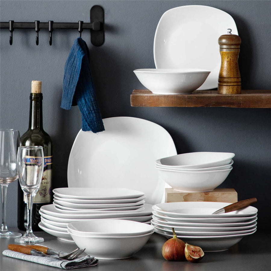24-Piece Porcelain Set In White With Square And Round Edges, Offering Versatility, Stackability, And Elegance For Both Casual And Formal Dining.