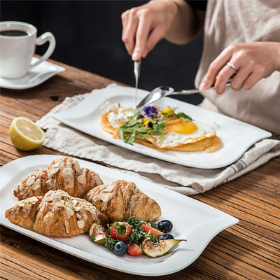 L'arte della colazione Sperimentare i croissant con il miglior servizio di stoviglie in porcellana