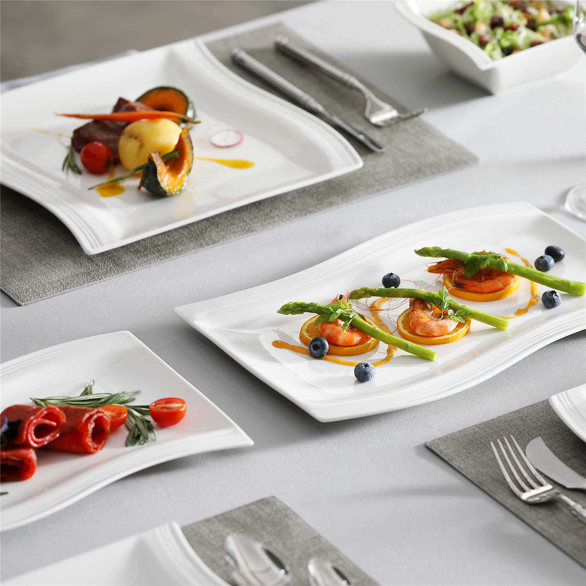 26-Piece Porcelain Set In Ivory White With Square Wavy Design, Perfect For Stylishly Serving Cowboy Butter And Enhancing Your Dining Presentation.