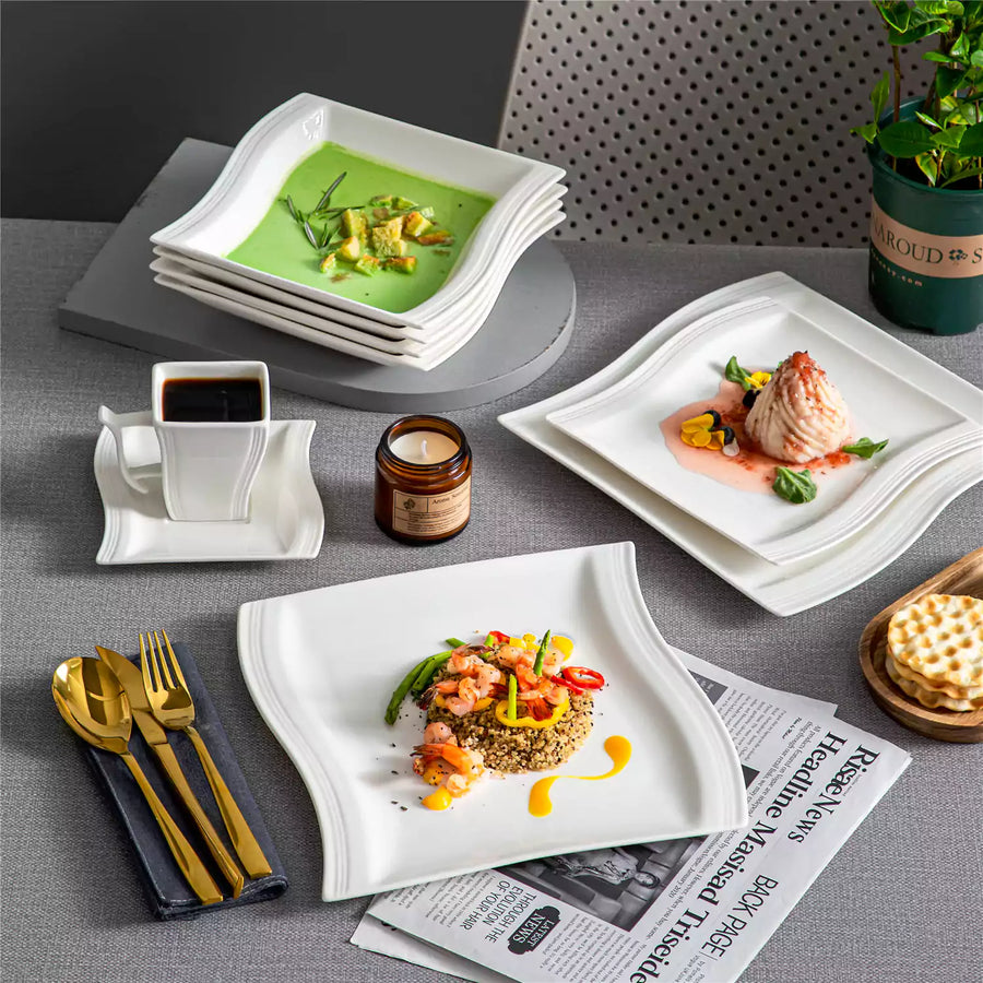 Small appetizer plates arranged with desserts, cheese, finger foods, and serving platters for casual entertaining and shared dining.