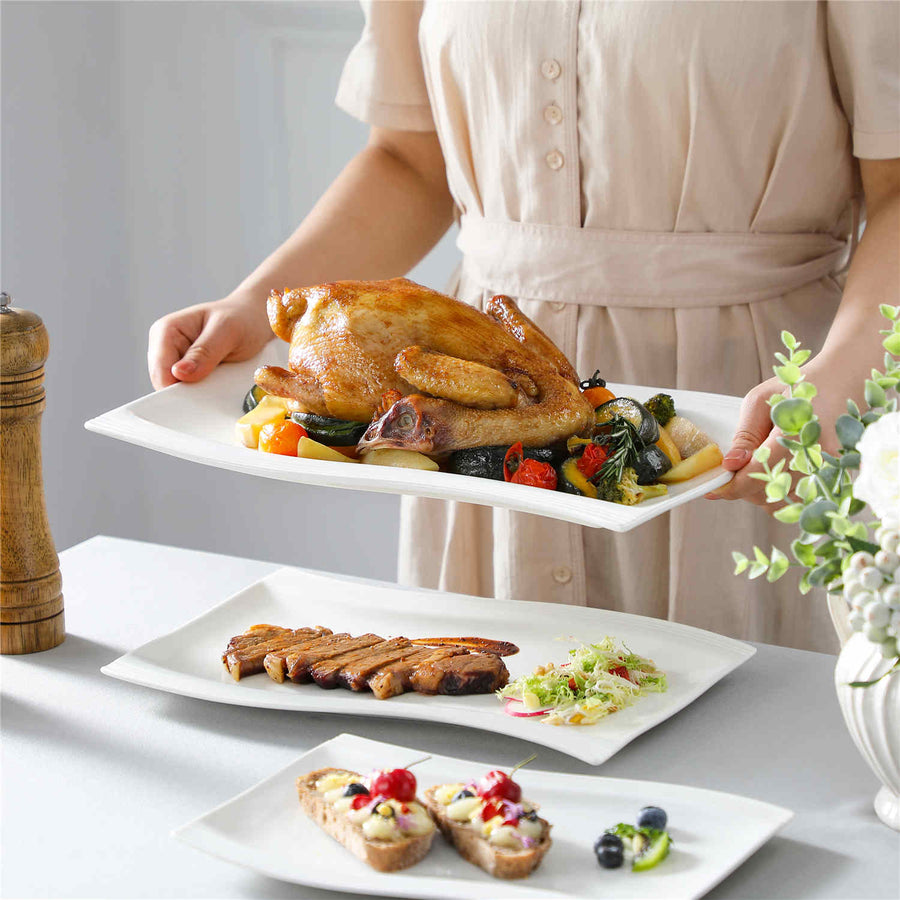 Platters Set Of 3 In Ivory White Porcelain, Featuring Wavy Rectangular Designs For Stylish And Functional Serving At Any Gathering.