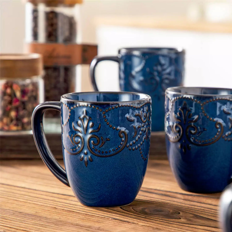 Two white coffee mugs side by side — a 12 oz and a 16 oz — on a clean kitchen counter, illustrating the size difference to help you choose the right coffee mug for your daily routine.