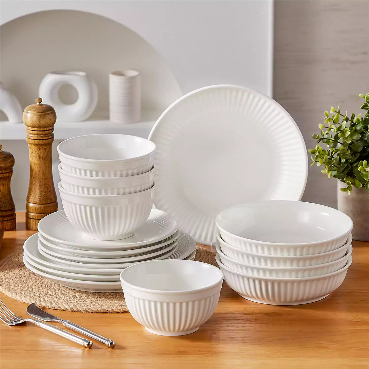 Kitchen dinnerware storage guide showing organized plates, bowls, and serving dishes neatly arranged in cabinets and drawers