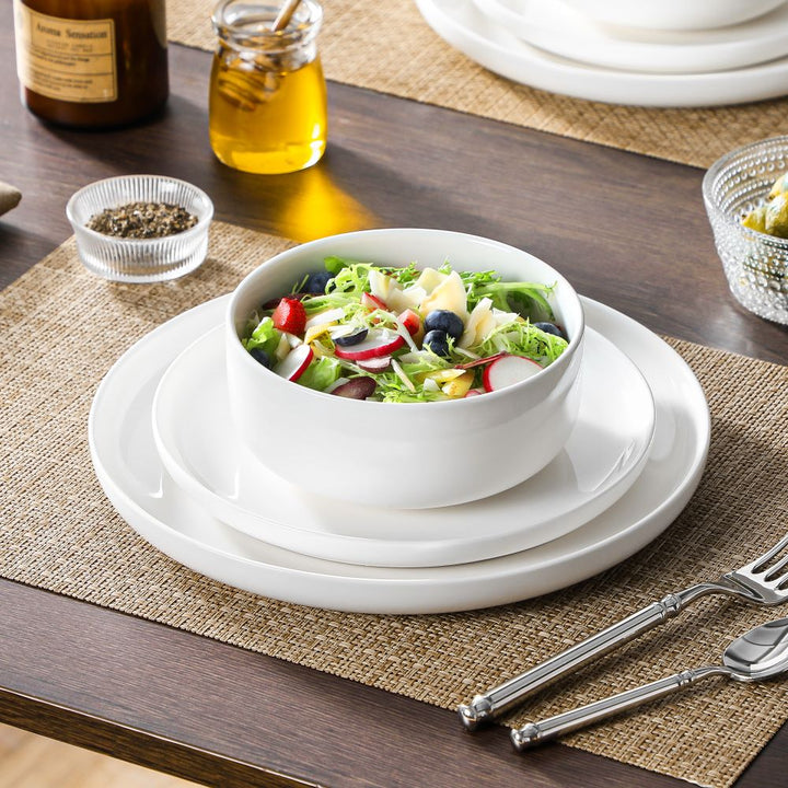 White porcelain Chinese rice bowls, noodle bowls, and small side bowls with rice, noodle soup, and home-style dishes, showing their uses in everyday Chinese meals.