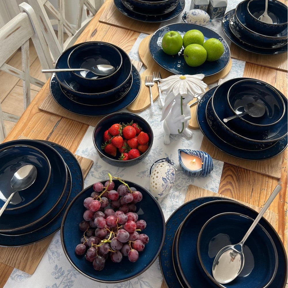 Blue dinnerware set creating a calm and coastal dining vibe with natural textures and modern table styling.