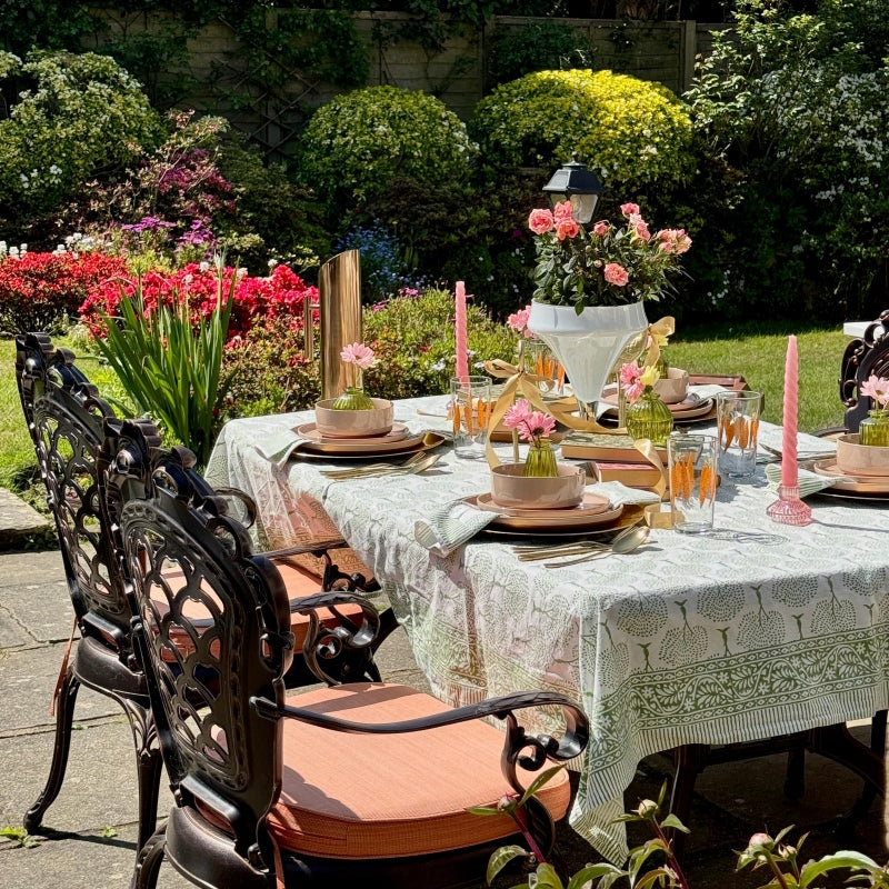Elegant tea party at home featuring porcelain plates, dessert plates, and a beautifully styled afternoon tea table