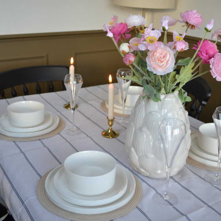 A hypoallergenic kitchen setup featuring white porcelain dinnerware, highlighting non-toxic, non-porous surfaces that help reduce allergens and create a cleaner, safer environment for allergy sufferers.