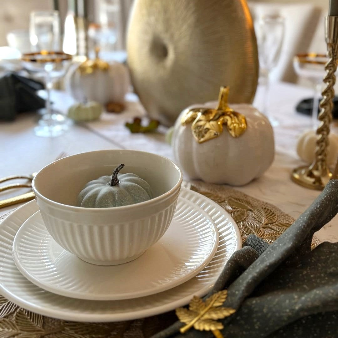 Textured tableware including ribbed, speckled, and embossed designs that enhance the dining experience through tactile and visual appeal.