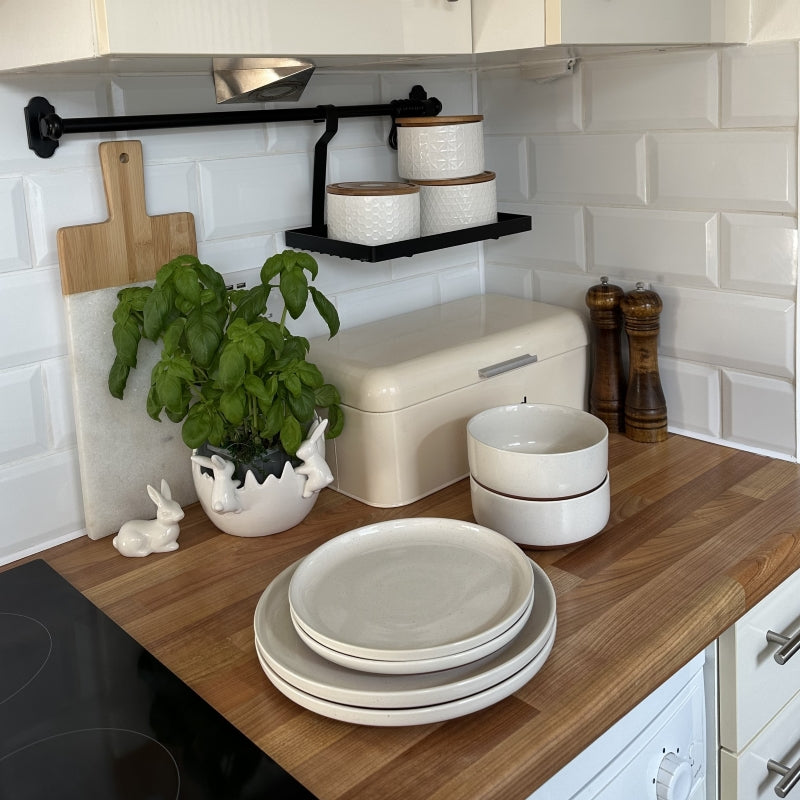 Styling open kitchen shelves with white dinnerware sets for a modern and organized kitchen look