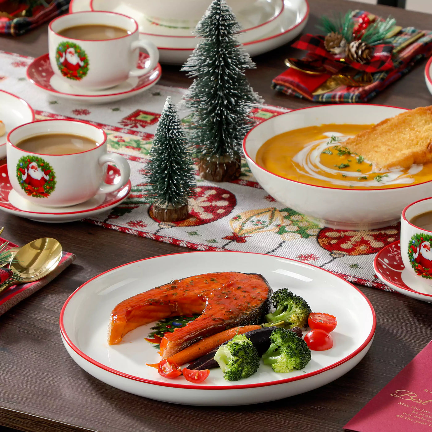 30-piece Christmas porcelain dinnerware set with a joyful Santa Claus motif, snowflakes, and polka dots; includes dinner plates, salad plates, soup plates, cups, and saucers for six guests.