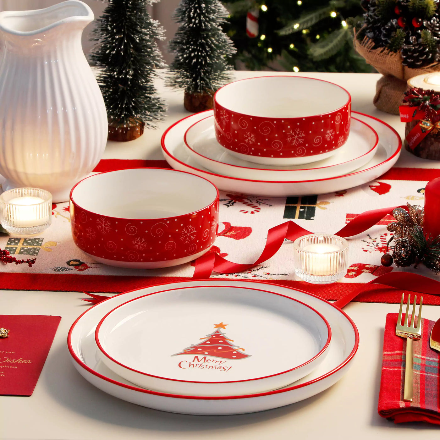 12-piece porcelain dinnerware set from the Christmas Collection, featuring a red Christmas tree topped with a gold star and surrounded by delicate snowflakes; includes plates and bowls for four.