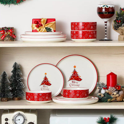 12-piece porcelain dinnerware set from the Christmas Collection, featuring a red Christmas tree topped with a gold star and surrounded by delicate snowflakes; includes plates and bowls for four.