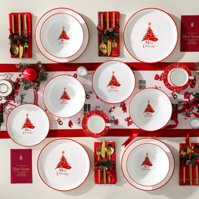 30-piece porcelain Christmas dinnerware set showcasing a red Christmas tree with a gold star and snowflake accents; includes dinner plates, salad plates, soup plates, cups, and saucers for six.