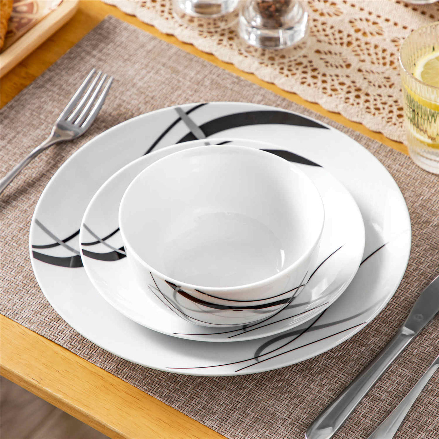 MALACASA Fiona 12-Piece Porcelain Dinnerware Set, Featuring Rounded Design, with Black and Gray Stripes, Includes Plates and Bowls.