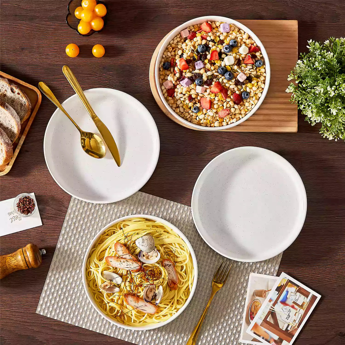 Leah 4-piece stoneware pasta bowls set with speckled glaze, non-slip bases, microwave, oven, and dishwasher safe, available in ivory and multicolor.#color_white