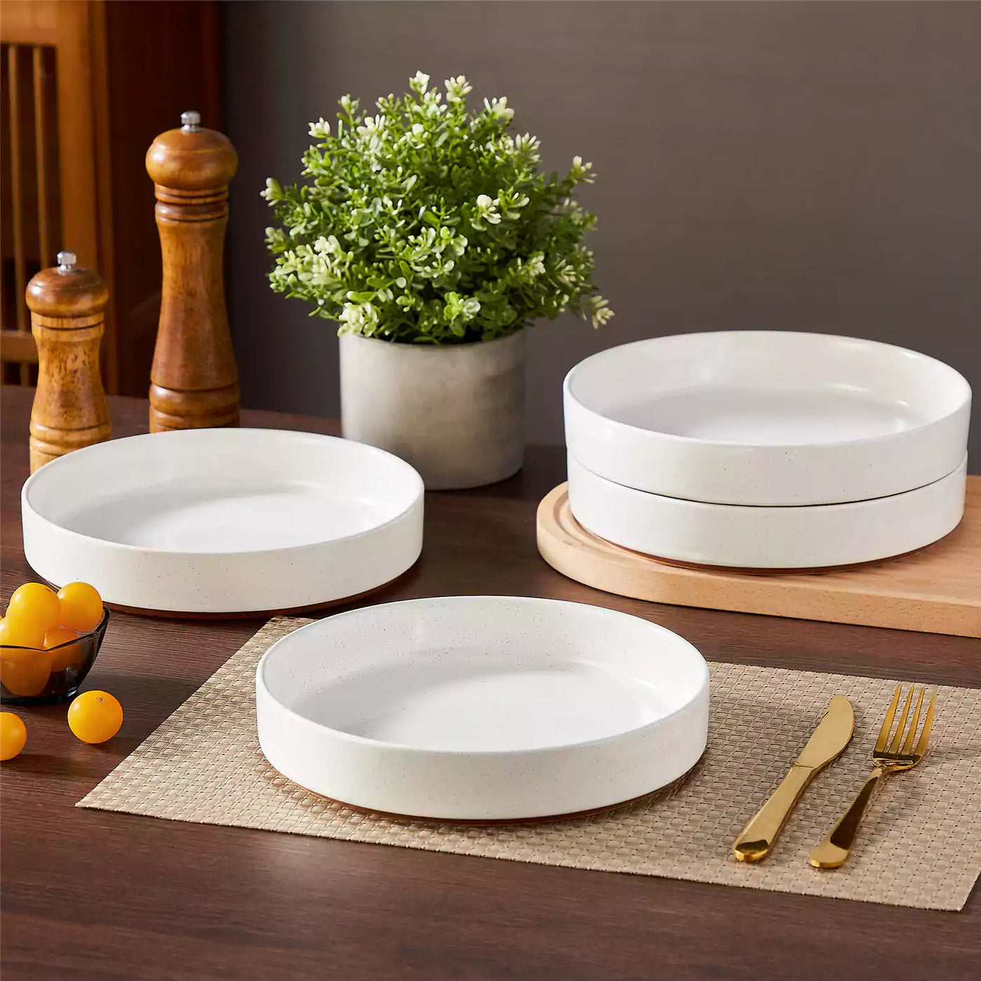 Leah 4-piece stoneware pasta bowls set with speckled glaze, non-slip bases, microwave, oven, and dishwasher safe, available in ivory and multicolor.#color_white