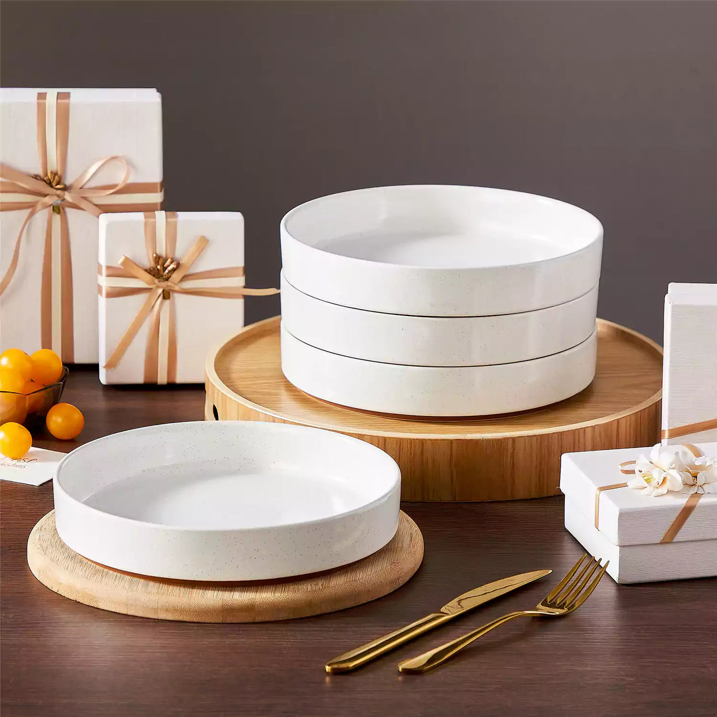 Leah 4-piece stoneware pasta bowls set with speckled glaze, non-slip bases, microwave, oven, and dishwasher safe, available in ivory and multicolor.#color_white