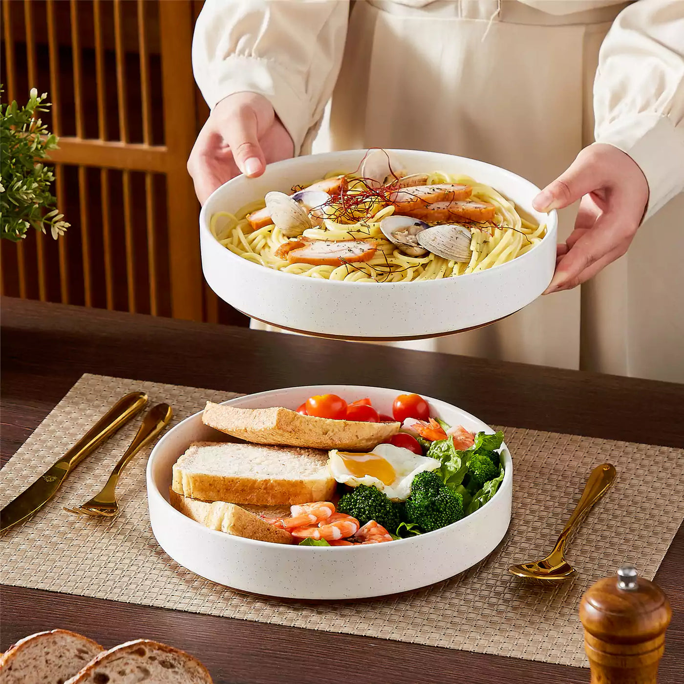 Leah 4-piece stoneware pasta bowls set with speckled glaze, non-slip bases, microwave, oven, and dishwasher safe, available in ivory and multicolor.#color_white