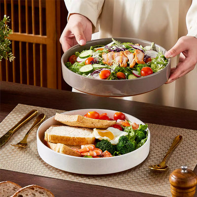 Leah 4-piece stoneware pasta bowls set with speckled glaze, non-slip bases, microwave, oven, and dishwasher safe, available in ivory and multicolor.#color_multicolor