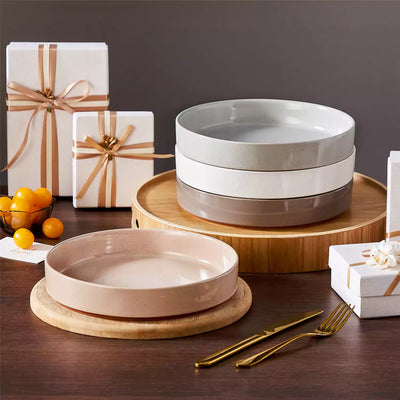 Leah 4-piece stoneware pasta bowls set with speckled glaze, non-slip bases, microwave, oven, and dishwasher safe, available in ivory and multicolor.#color_multicolor