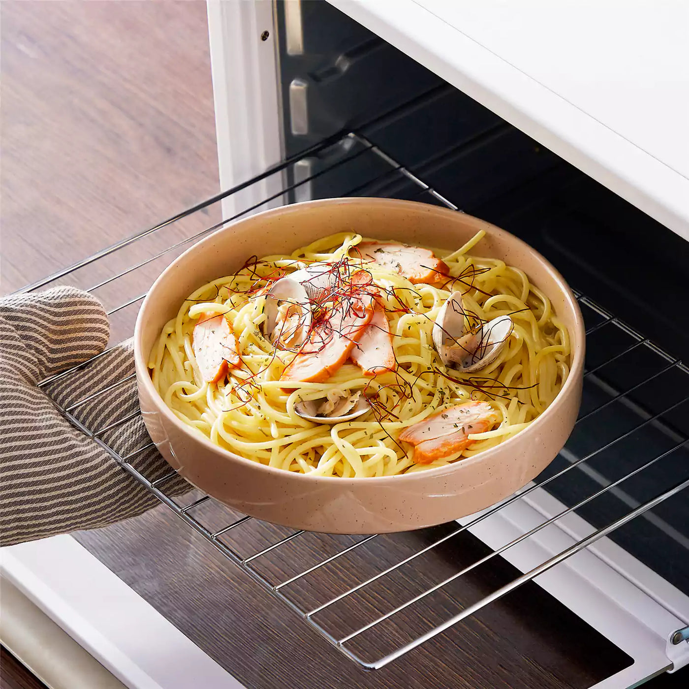 Leah 4-piece stoneware pasta bowls set with speckled glaze, non-slip bases, microwave, oven, and dishwasher safe, available in ivory and multicolor.#color_multicolor