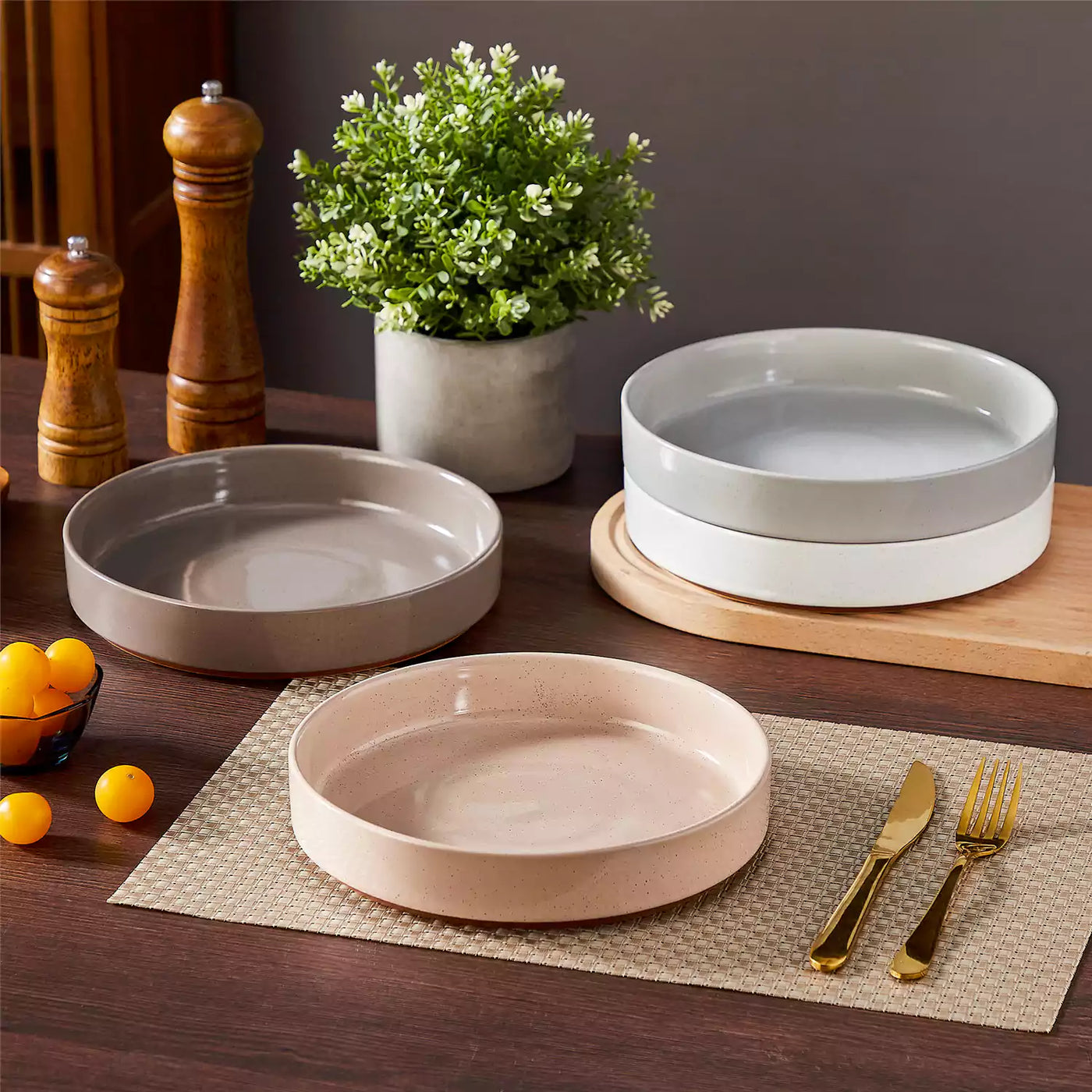 Leah 4-piece stoneware pasta bowls set with speckled glaze, non-slip bases, microwave, oven, and dishwasher safe, available in ivory and multicolor.#color_multicolor