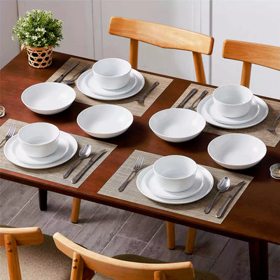LEXI off-white porcelain dinnerware set including arc-shaped plates with lifted rims and deep rounded bowls#color_white