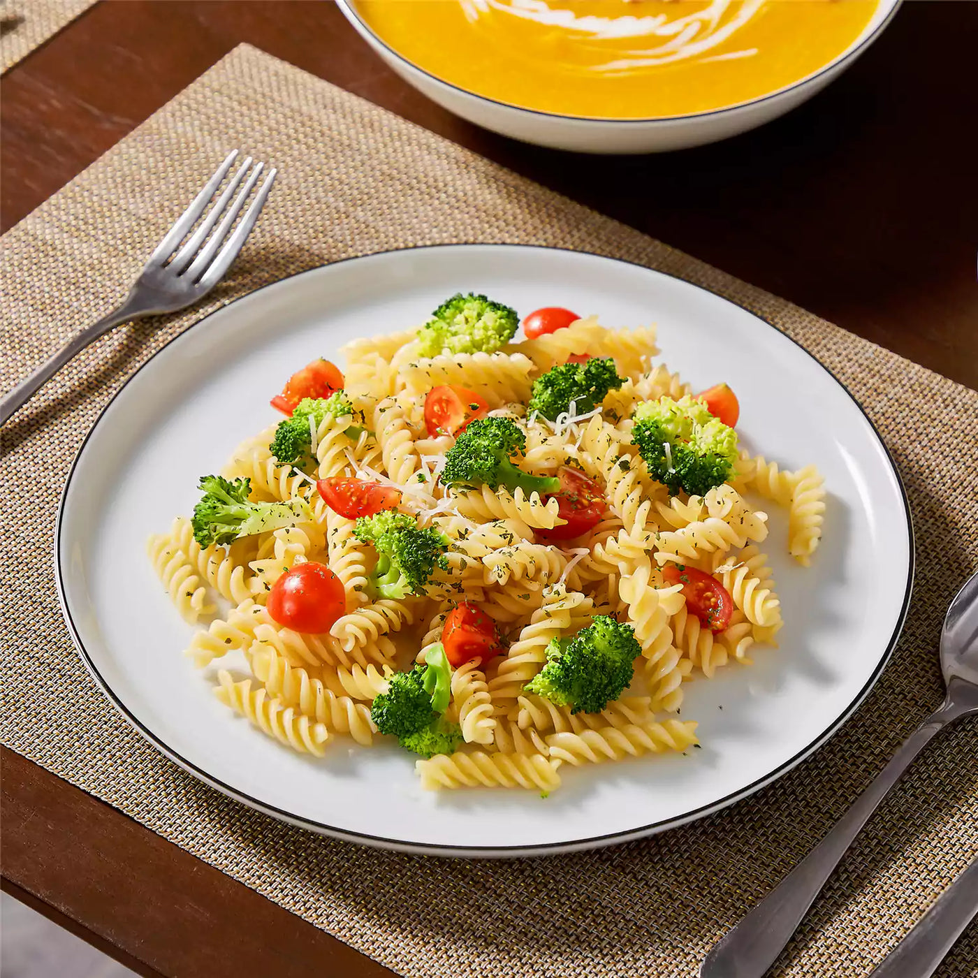 LEXI off-white porcelain dinnerware set including arc-shaped plates with lifted rims and deep rounded bowls#color_black-trim