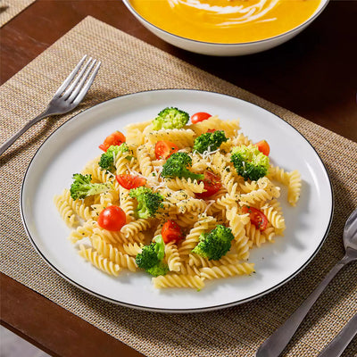 LEXI off-white porcelain dinnerware set including arc-shaped plates with lifted rims and deep rounded bowls#color_black-trim