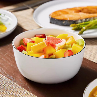 LEXI off-white porcelain dinnerware set including arc-shaped plates with lifted rims and deep rounded bowls#color_black-trim