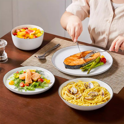 LEXI off-white porcelain dinnerware set including arc-shaped plates with lifted rims and deep rounded bowls#color_black-trim