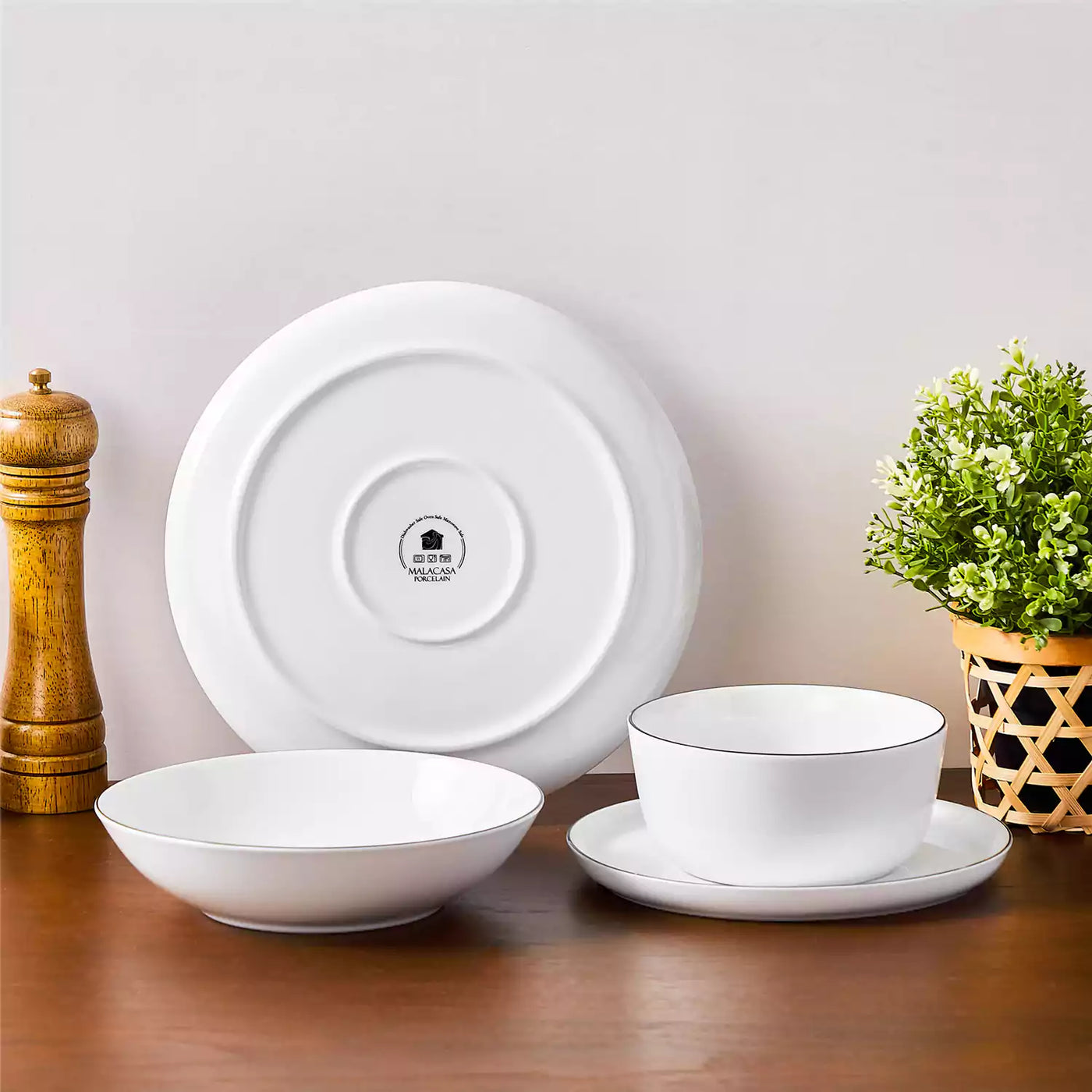 LEXI off-white porcelain dinnerware set including arc-shaped plates with lifted rims and deep rounded bowls#color_black-trim
