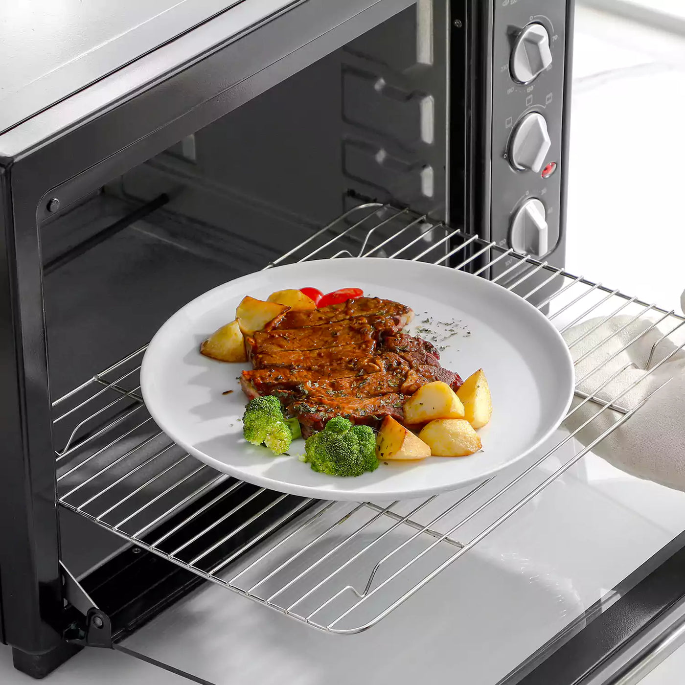 LEXI off-white porcelain dinnerware set including arc-shaped plates with lifted rims and deep rounded bowls#color_white