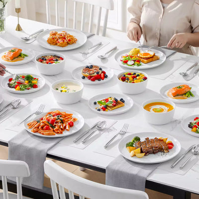 LEXI off-white porcelain dinnerware set including arc-shaped plates with lifted rims and deep rounded bowls#color_white