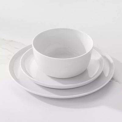 LEXI off-white porcelain dinnerware set including arc-shaped plates with lifted rims and deep rounded bowls#color_white