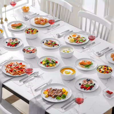 LEXI off-white porcelain dinnerware set including arc-shaped plates with lifted rims and deep rounded bowls#color_white