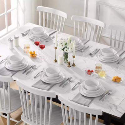 LEXI off-white porcelain dinnerware set including arc-shaped plates with lifted rims and deep rounded bowls#color_white