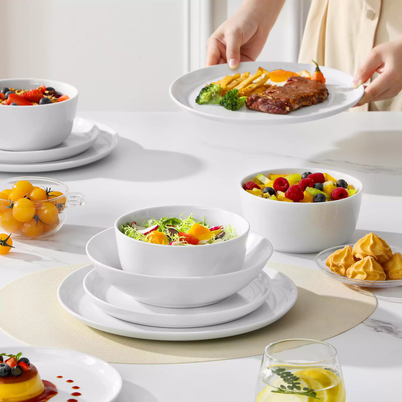 LEXI off-white porcelain dinnerware set including arc-shaped plates with lifted rims and deep rounded bowls#color_white