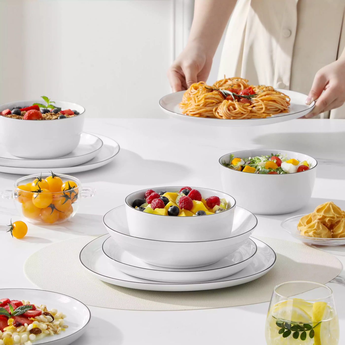 LEXI off-white porcelain dinnerware set including arc-shaped plates with lifted rims and deep rounded bowls#color_black-trim