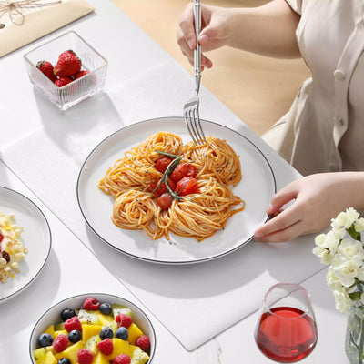 LEXI off-white porcelain dinnerware set including arc-shaped plates with lifted rims and deep rounded bowls#color_black-trim