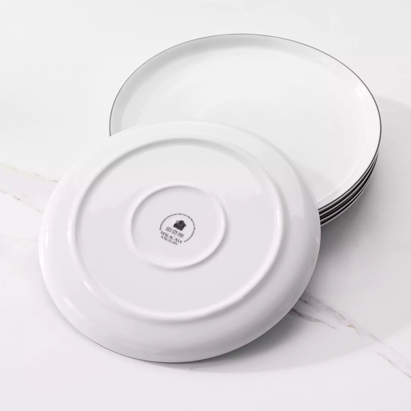 LEXI off-white porcelain dinnerware set including arc-shaped plates with lifted rims and deep rounded bowls#color_black-trim